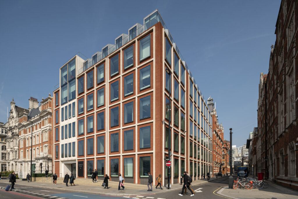 Street view of Carmelite House at Carmelite Riverside, London EC4, with pedestrians passing the entrance