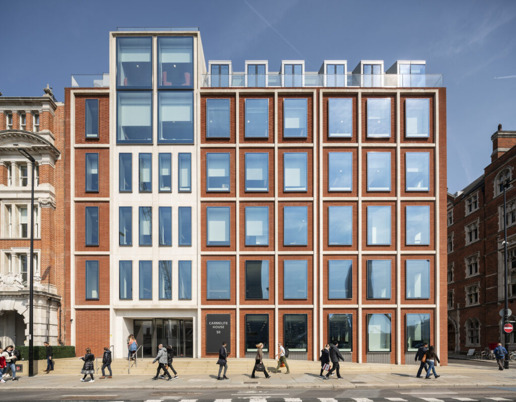 Corner view of Carmelite House at Carmelite Riverside, showing its brick and glass facade