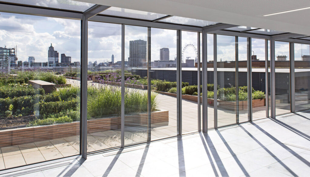 Roof terrace at Carmelite Riverside with planting and a view across the London skyline