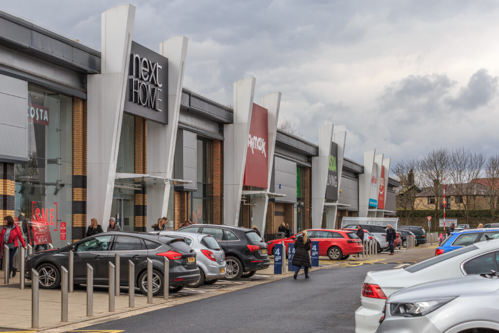 Next Home, TK Maxx and Asda Living store fronts and car park at Westside Shopping Park