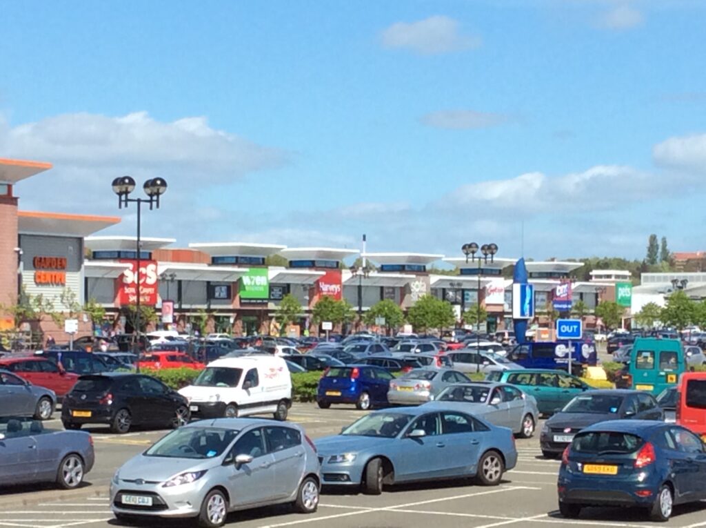 Row of retail units and car park at the Great Western Retail Park, including carpet and furniture stores