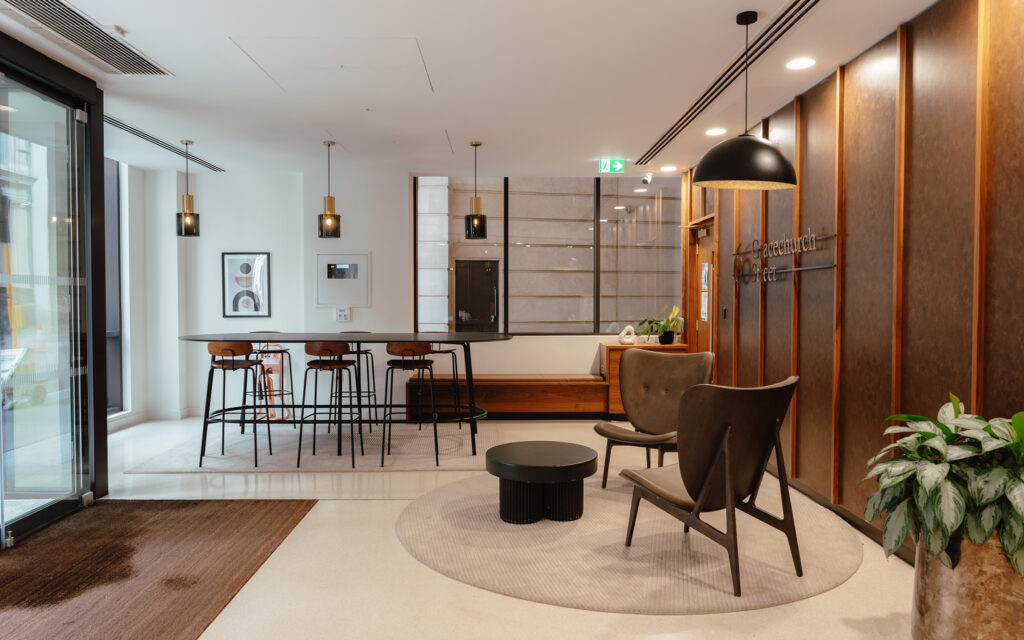 Breakout area at 6 Gracechurch Street with a high table, bar stools and lounge seating
